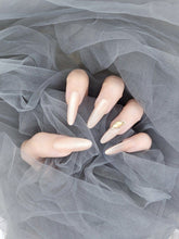 Moon River: Sheer Nude Pink Stiletto Nails with Crystal Instant Mani