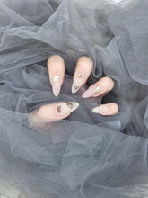 Bloom Serenity: Almond Nails in Matte Nude Pink with gold and Floral Designs