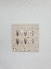 Whispering Waves: Pearlescent White Almond Nails for Everyday Manicure